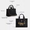 Τσάντα Disney X Coach Cargo Tote Bag 26 με τον Μίκυ Μάους από καμβά αναγεννημένου βαμβακιού