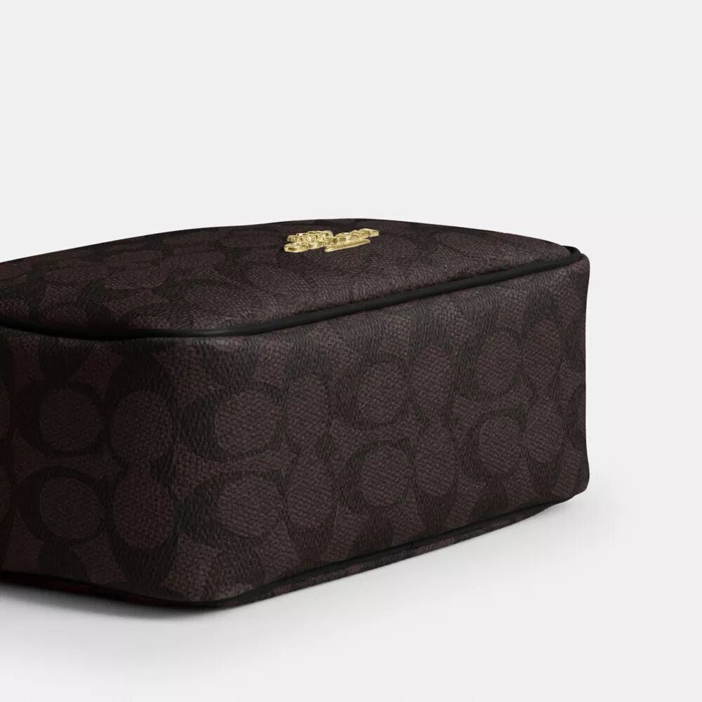 Τσάντα Mini Carey για φορά χιαστί από το Signature Canvas